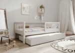 ALFIE klasyczne drewniane łóżko dziecięce z okrągłymi szczebelkami i szufladą z funkcją spania